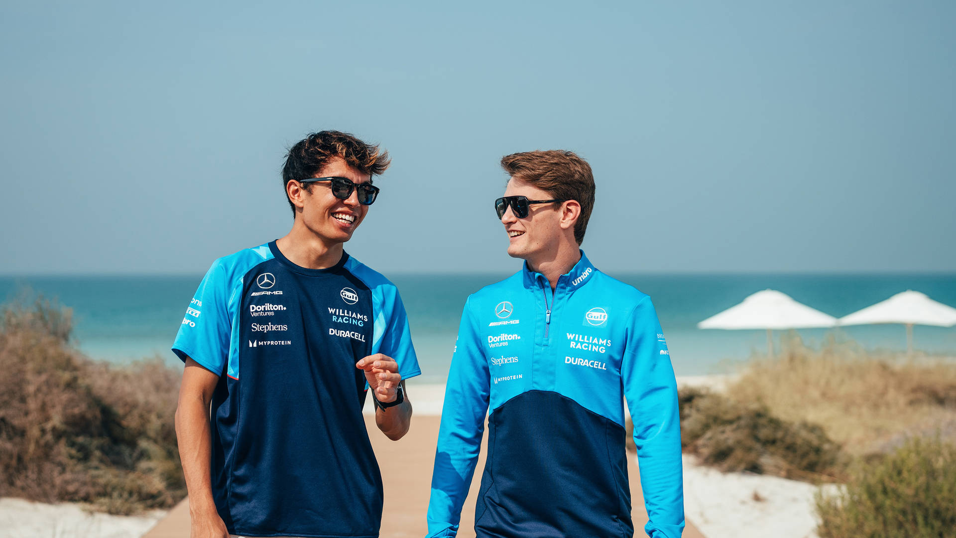 Alex Albon and Logan Sargeant exploring the beach at Jumeirah at Saadiyat Island Resort