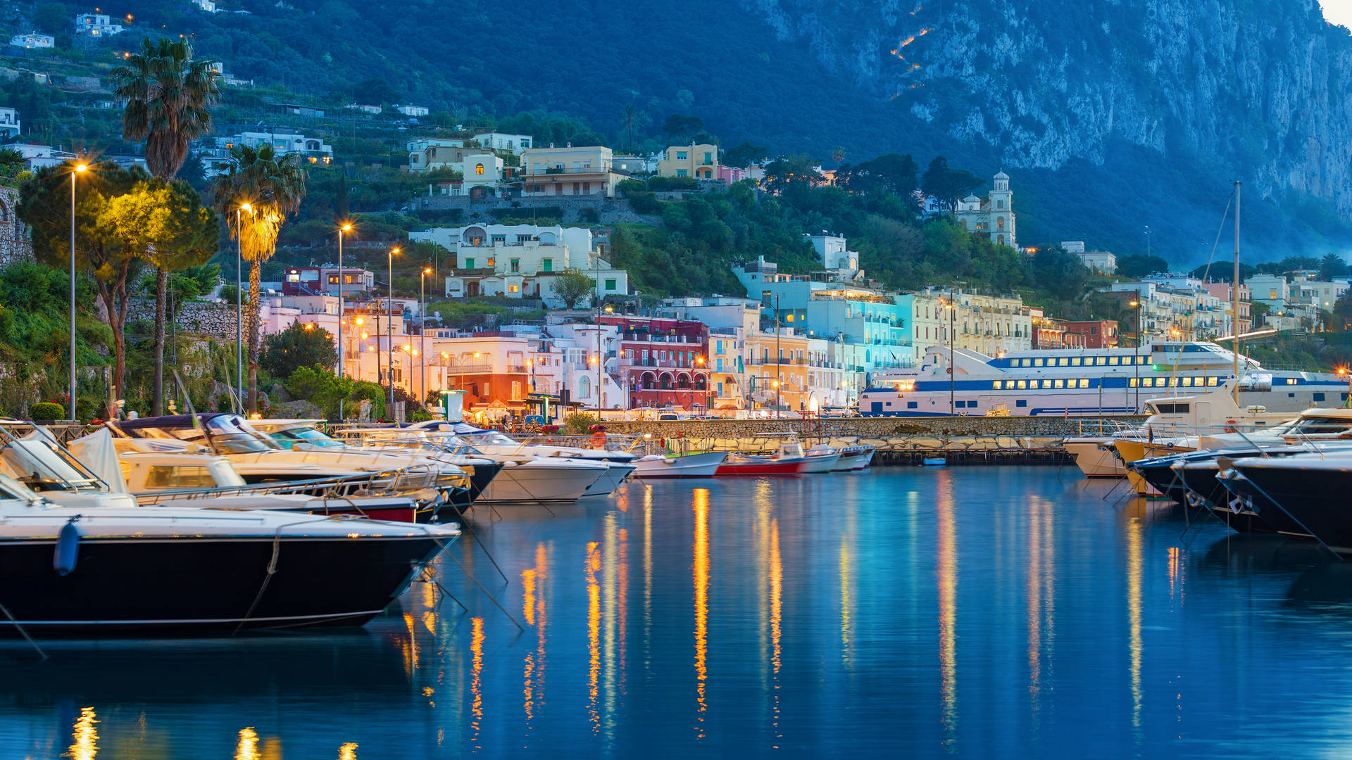 Sunset view of Capri harbour in Italy