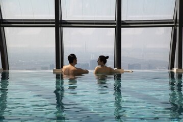 Jumeirah nanjing lifestyle couple in the pool
