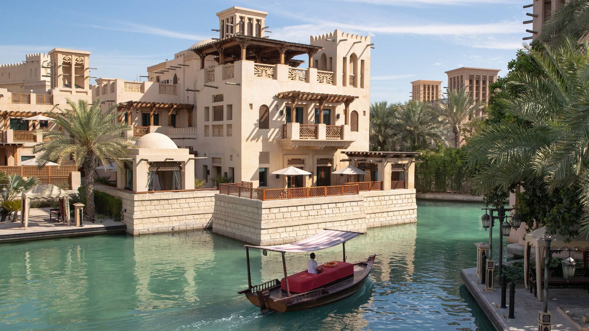 Abra gliding along the picturesque waterways at Madinat Jumeirah in Dubai