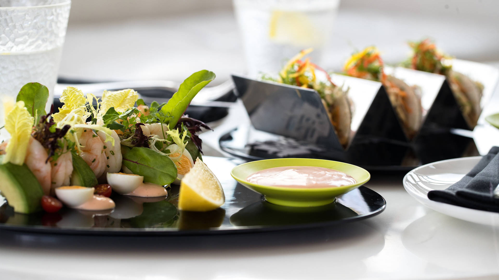 Image of fresh salad and prawn tacos served at Cuba Bar at Jumeirah Creekside Hotel