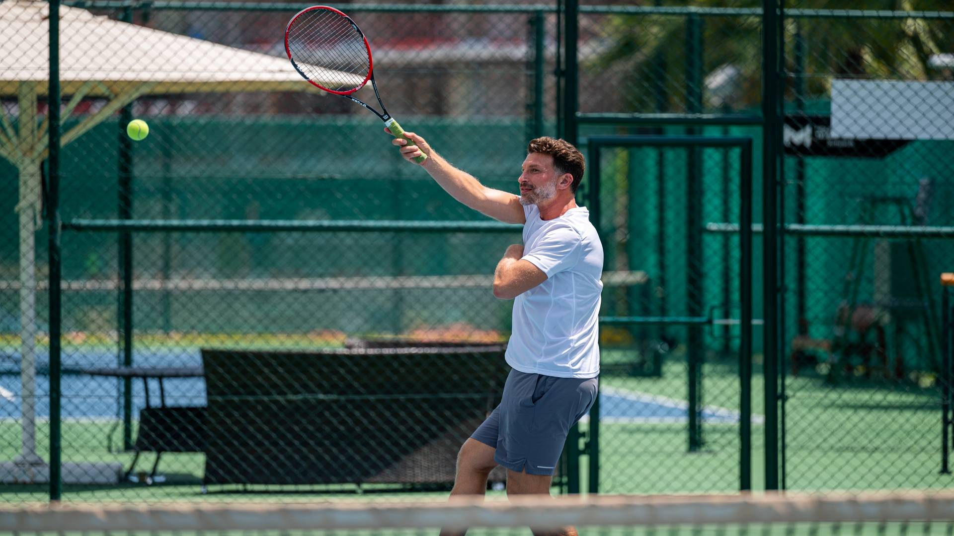 A man playing tennis at Jumeirah Beach Hotel