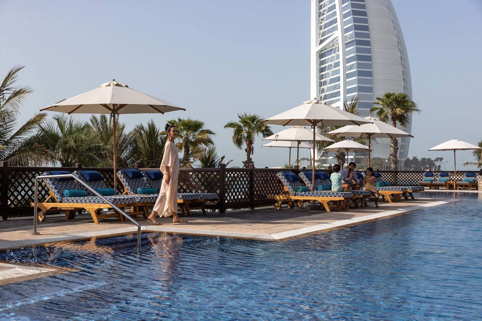 A woman strolling by Jumeirah Mina'Salam