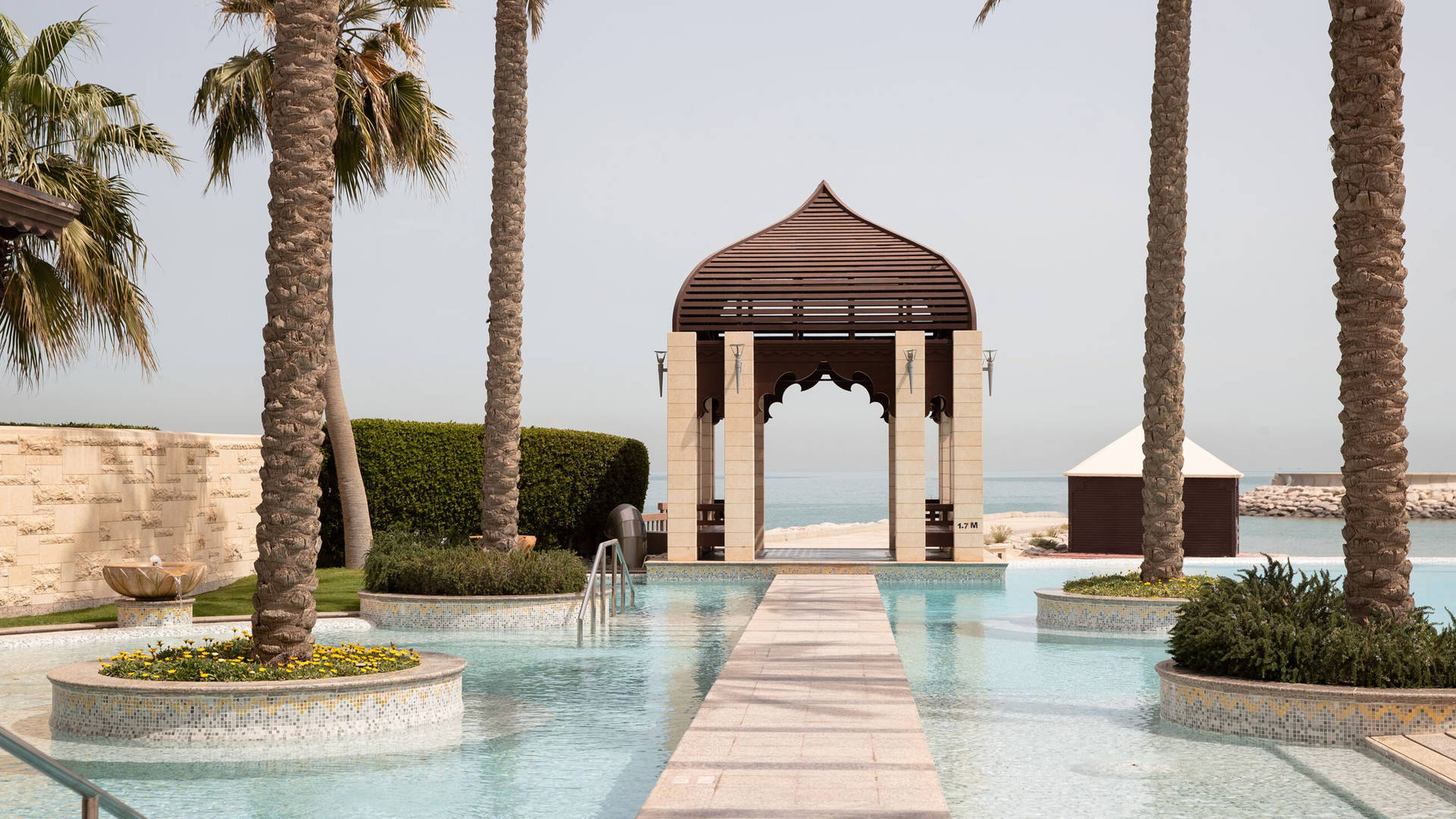 The landscaped infinity pool at Jumeirah Messilah Beach Hotel & Spa in Kuwait
