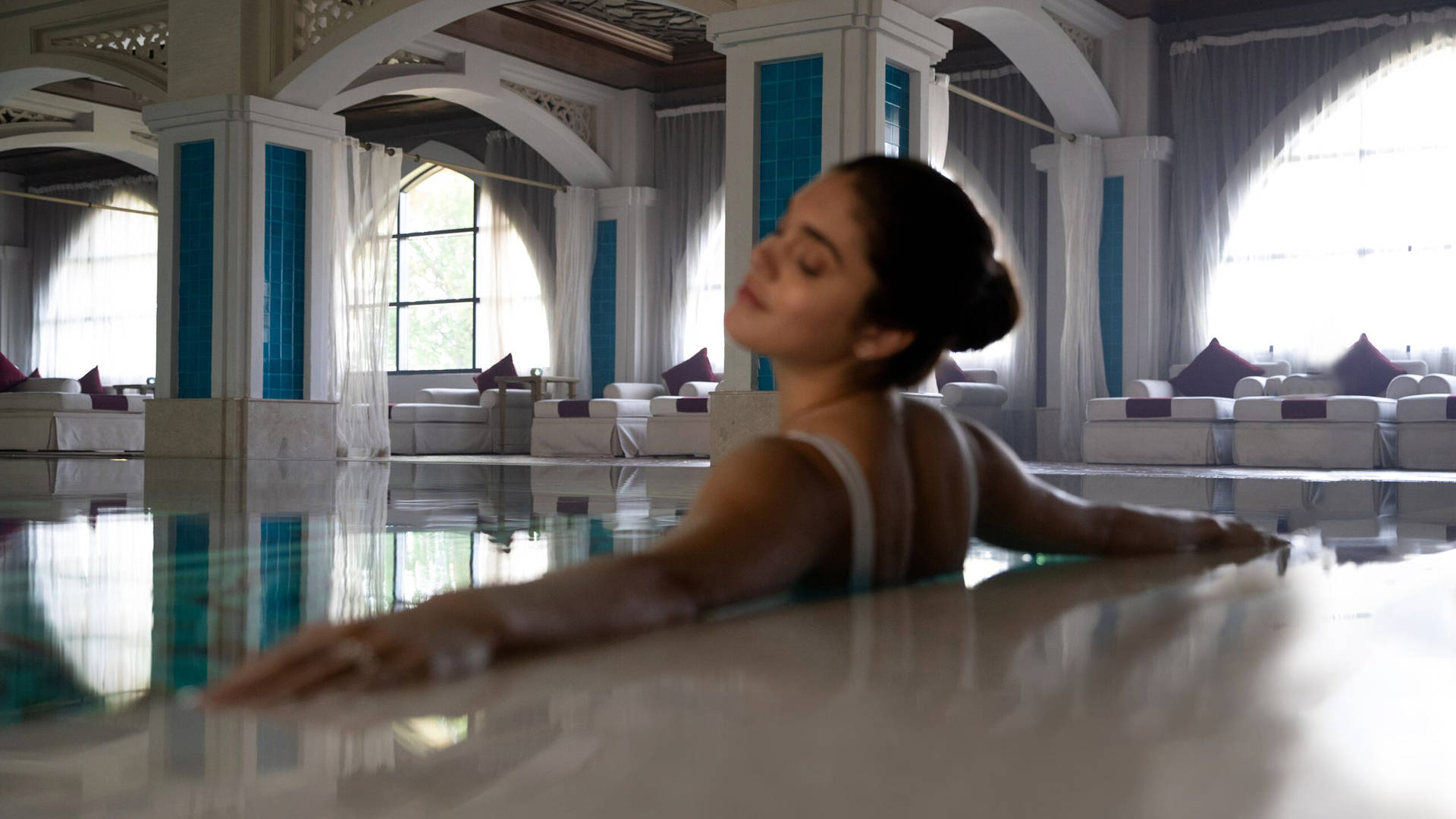 A woman relaxing in a Thalassotheraphy pool