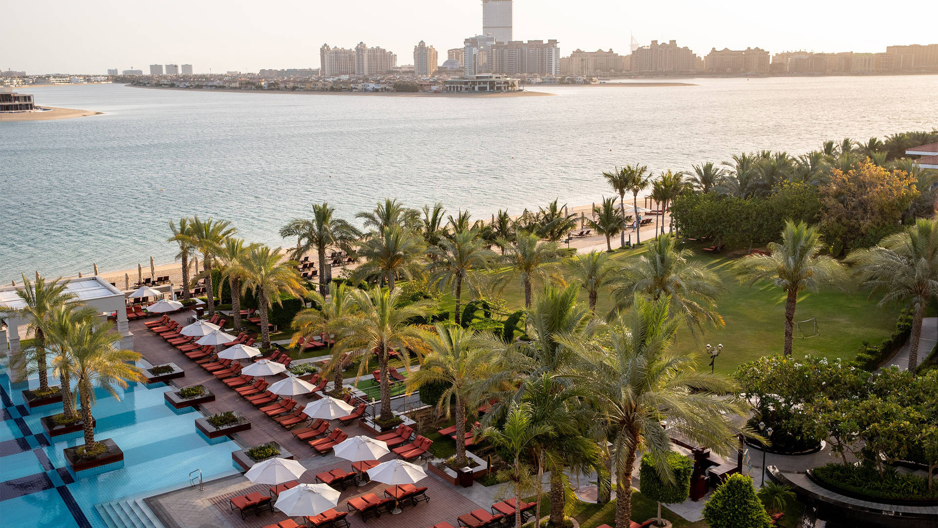 View of beach front and swimming pool at Jumeirah Zabeel Saray