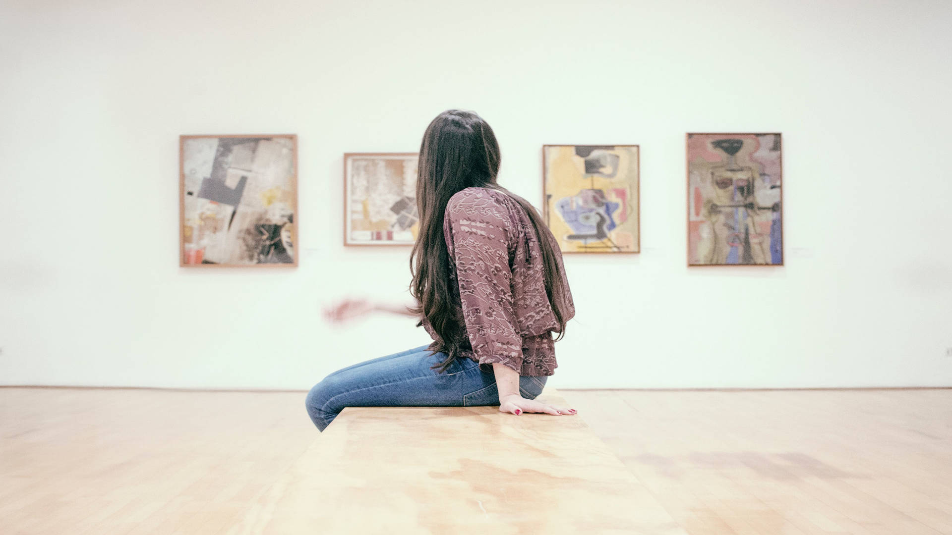 A woman visiting an art gallery in London