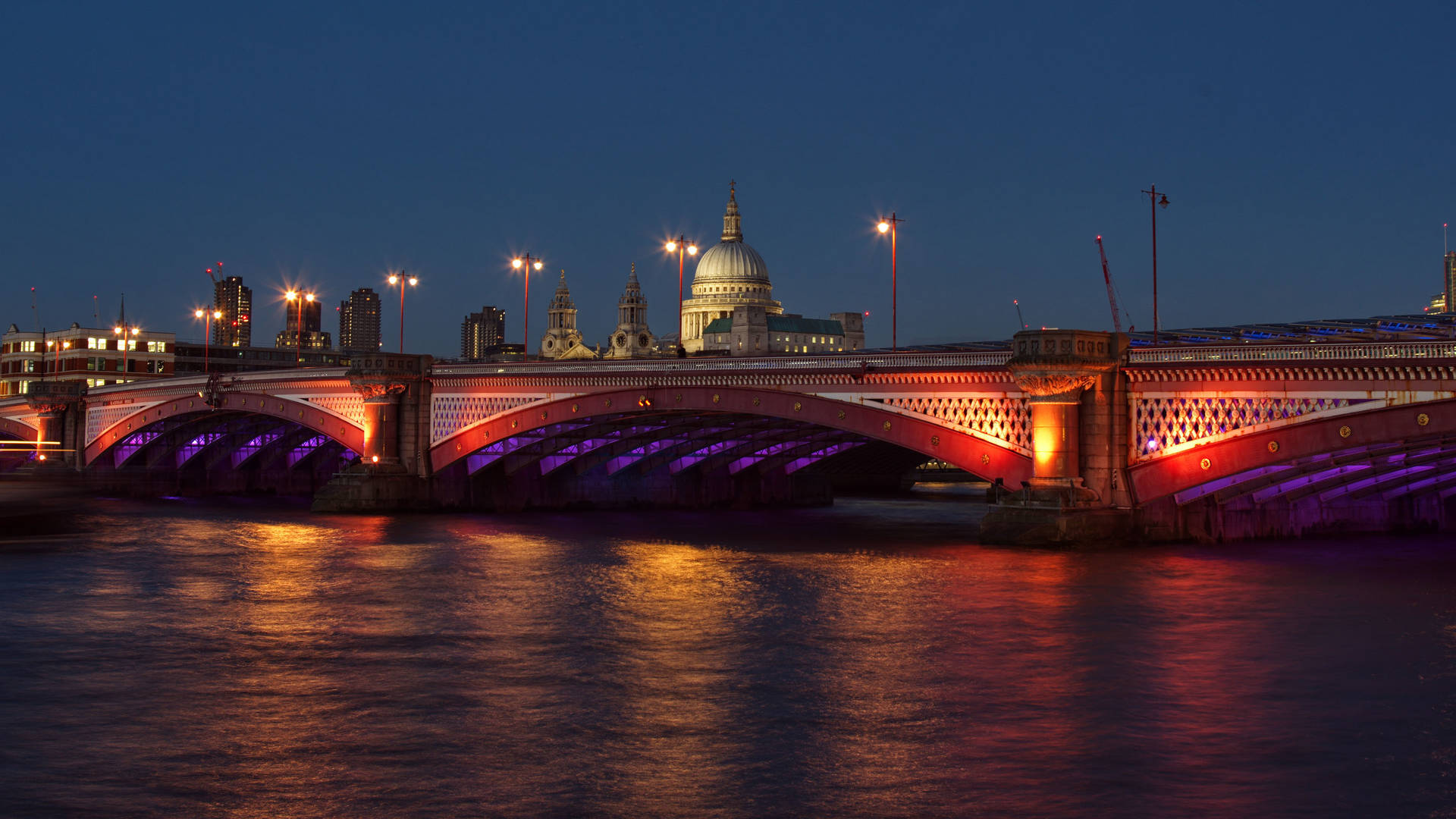 Illuminated Thames River at night London