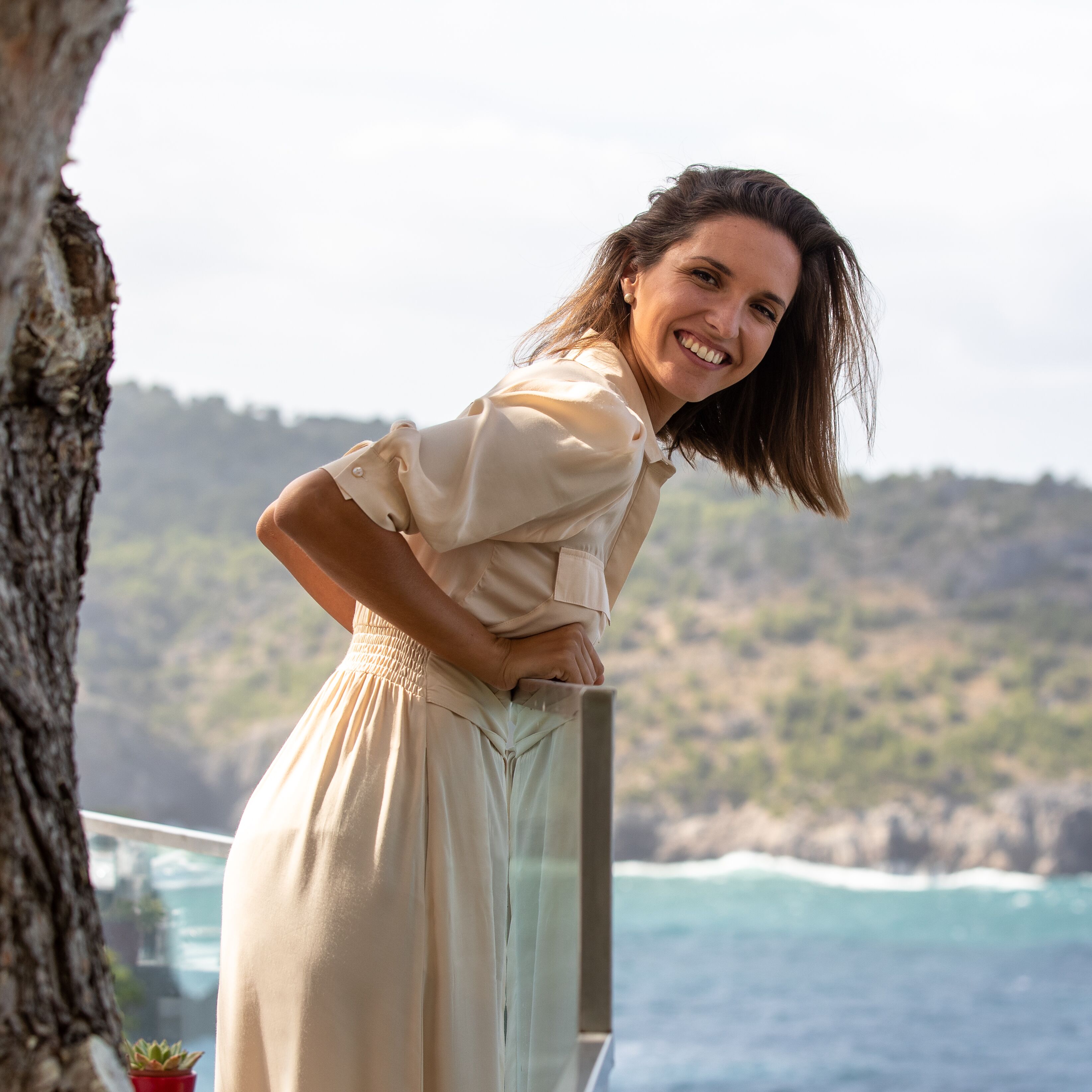 woman smiling by mallorca coast
