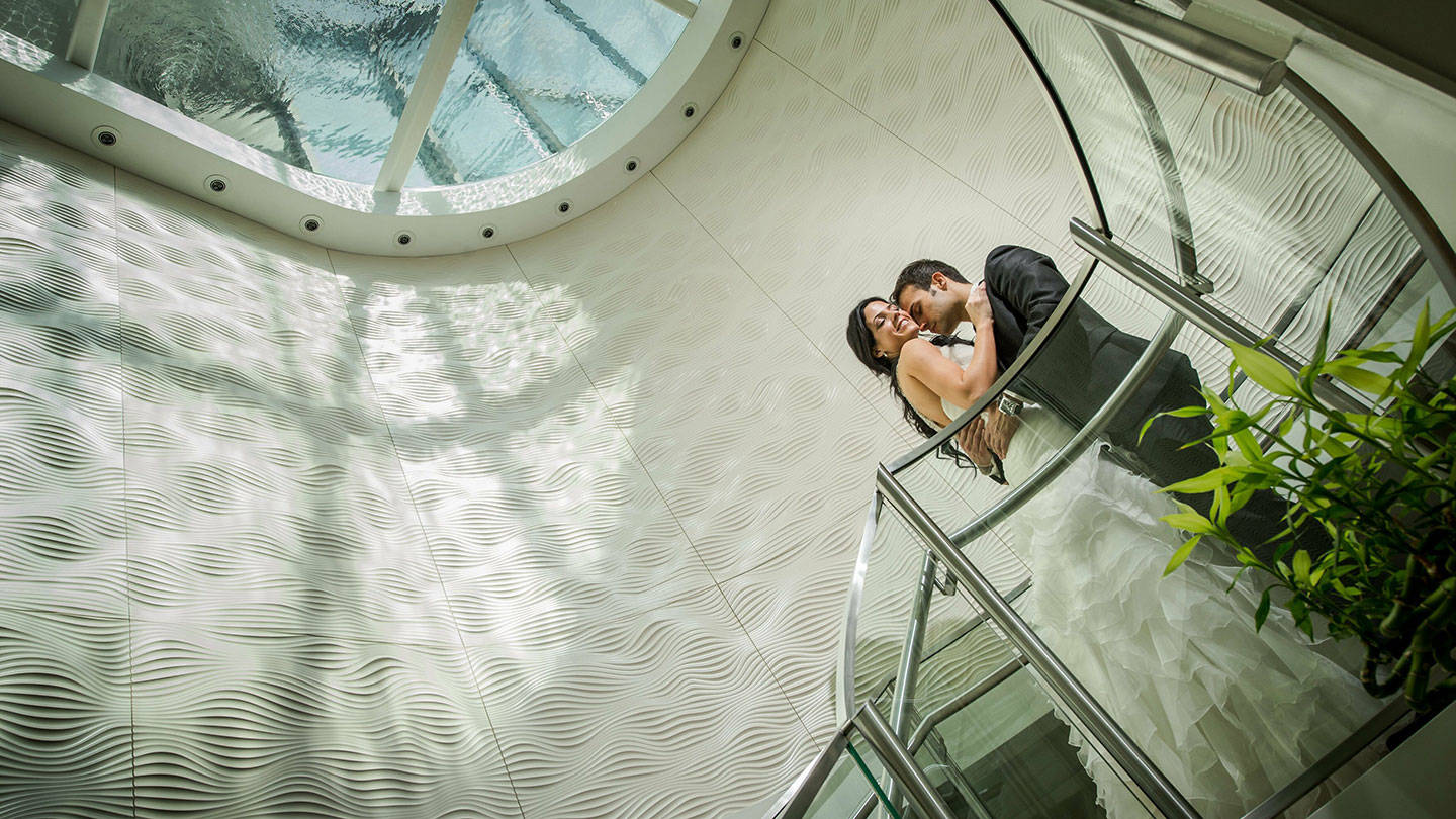 Wedding couple on staircase inside Jumeirah Port Soller Hotel & Spa
