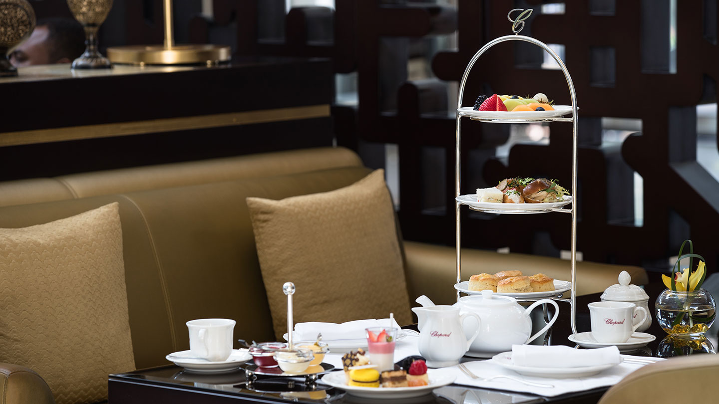Jumeirah Emirates Towers tea and tower of cakes in luxurious setting