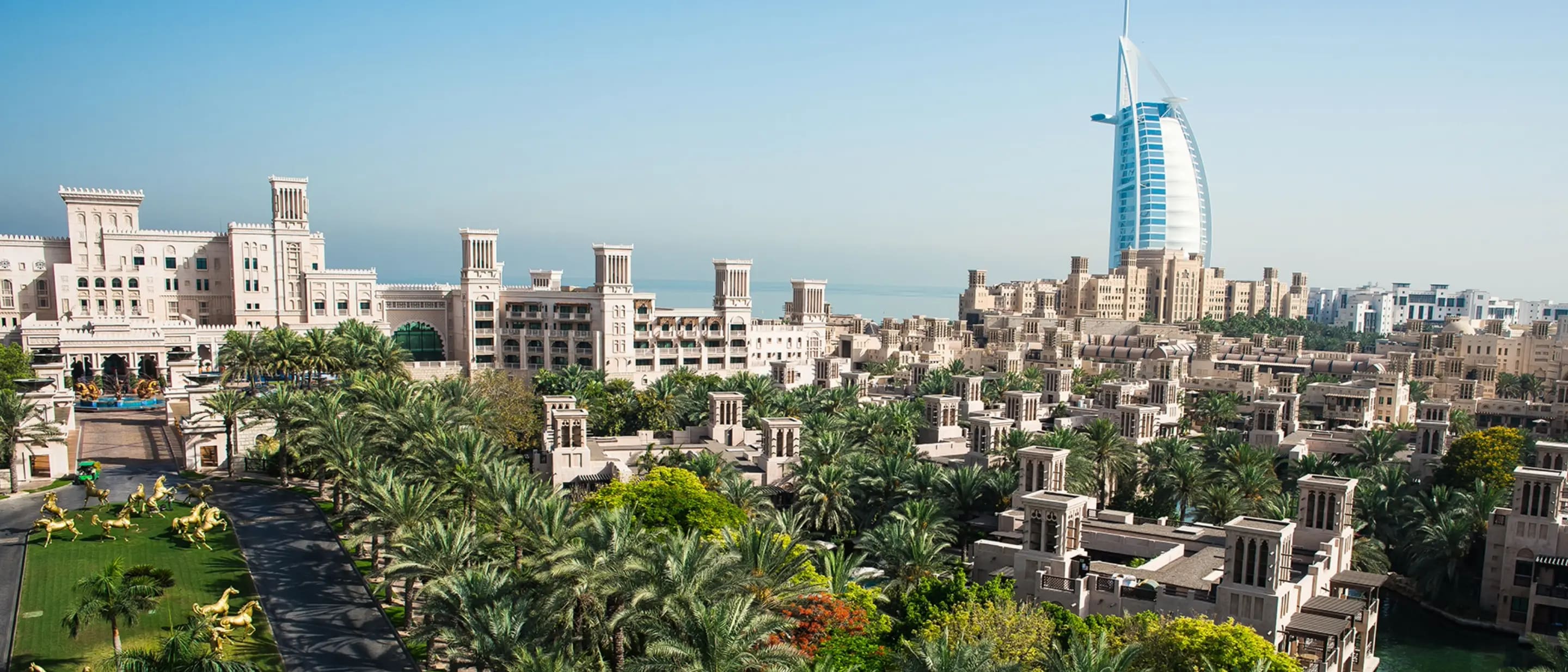 Umm Suqeim Open Beach Dubai Burj Al Arab side profile view free public sand