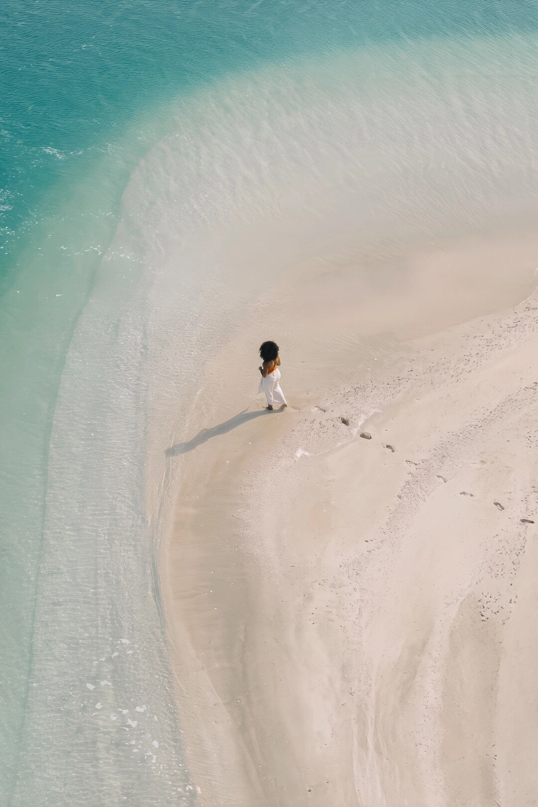 Jumeirah Burj Al Arab_Cape Morris_Lifestyle_Lady on Beach_Sea_Wide Drone.jpg