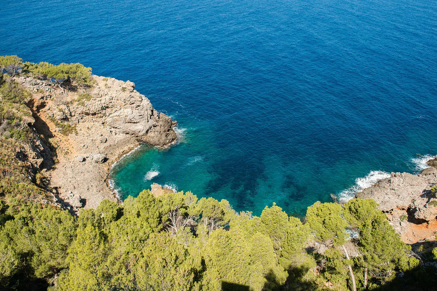Aerial view of cliffside and blue seas