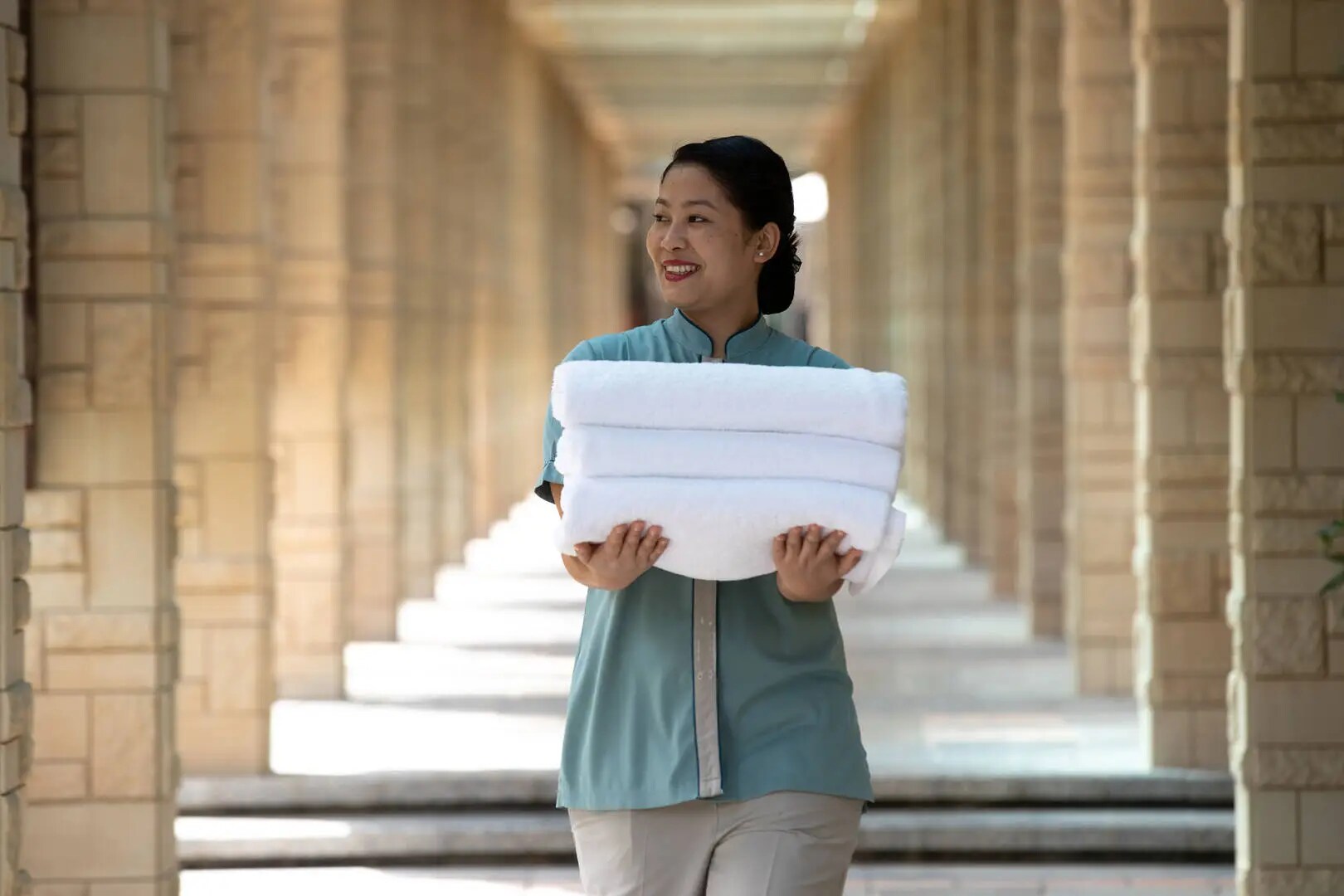 Jumeirah messilah beach hotel spa staff with towels
