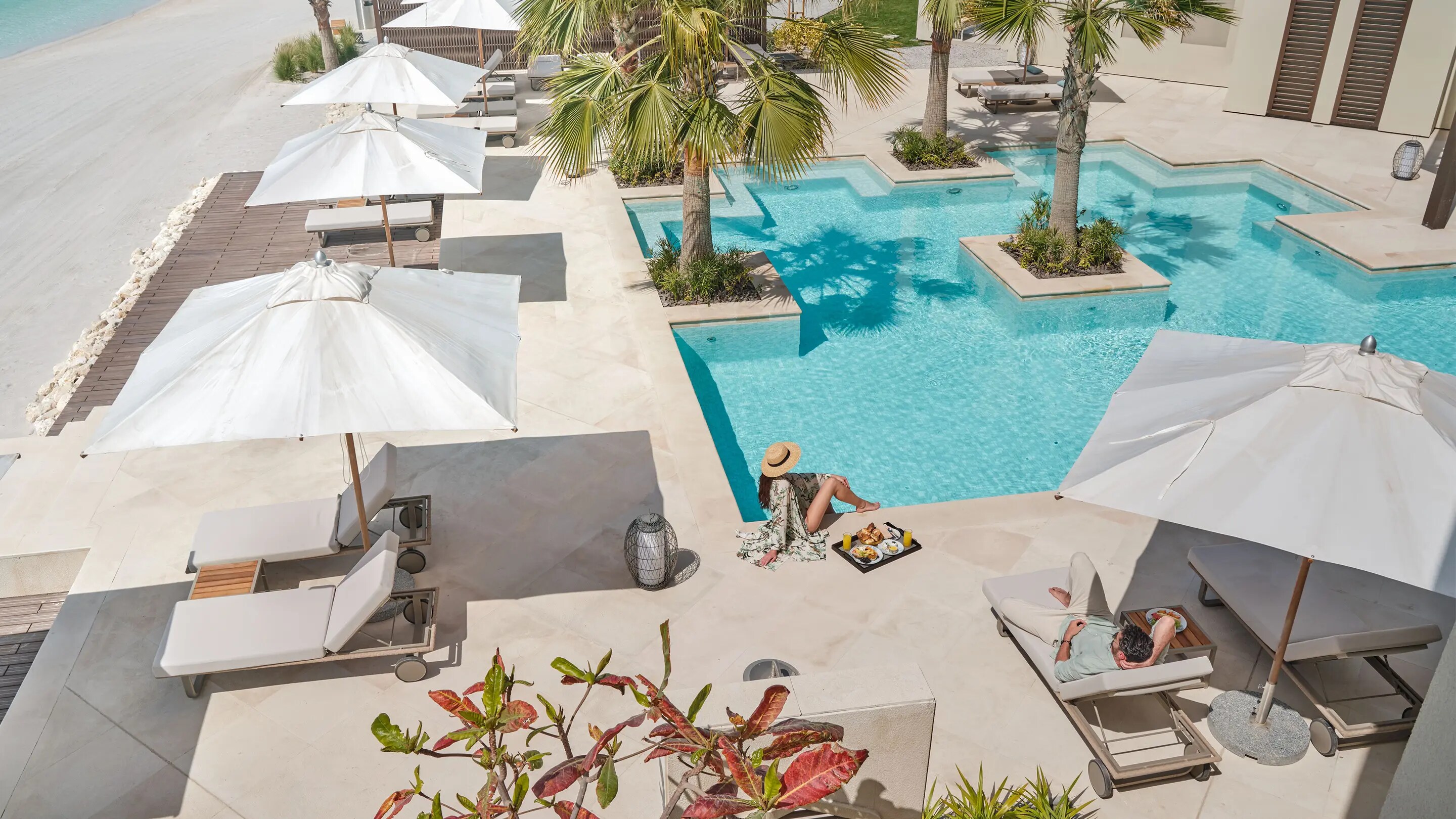 Couple relaxing at Jumeirah Gulf of Bahrain Resort and Spa