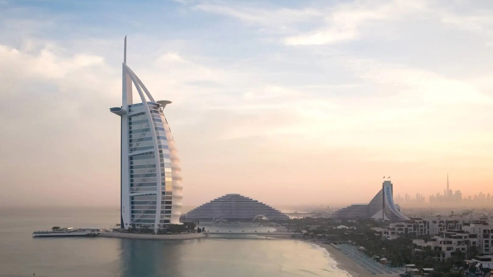 Airal exteria shot of Jumeirah Arab Burj Al Arab, including sea and beach